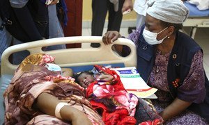 UNFPA Executive Director Natalia Kanem (right) visits a mother and baby at a hospital maternity ward in Sudan’s Blue Nile state.