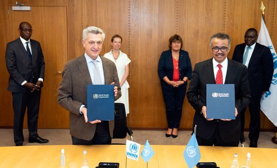 UN High Commissioner for Refugees Filippo Grandi (left) and Director-General, World Health Organization, Dr. Tedros Adhanom Ghebreyesus sign an agreement focused on the integration of refugees in national health preparedness and response plans.