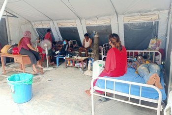 UNICEF staff and the Nepal Army install a medical tent on the premises of the overcrowded Bheri Hospital in Nepalgunj Sub-Metropolitan City, mid-western Nepal.