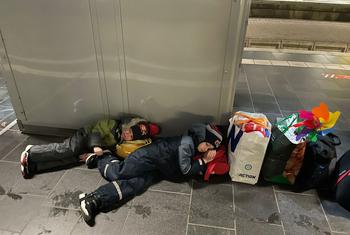 Ukrainian children sleep on the cold floor at Frankfurt train station in Germany.