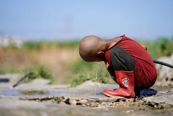 A child drinks water from the only source in Hesbi Camp in Saida, Lebanon.
