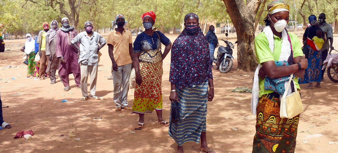 World Food Programme (WFP) institutes social distancing during food distribution in Kaya, Burkina Faso.