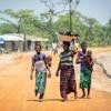 Refugee women from the Democratic Republic of the Congo walk towards the market in Mantapala Settlement, Zambia. 