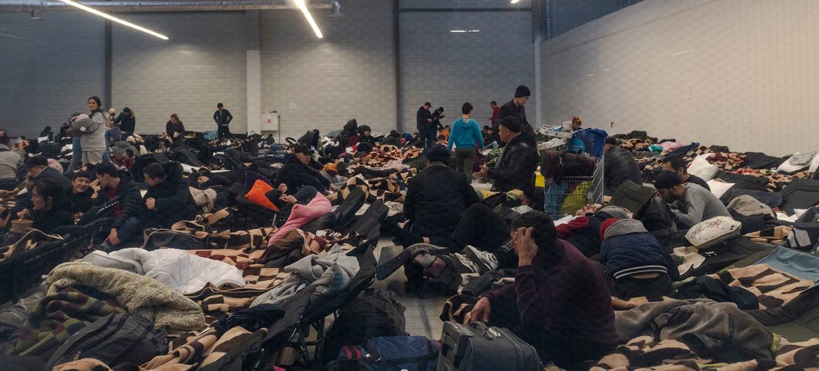 Hundreds of people fleeing Ukraine gather at shopping malls near the border in Korczowa, Poland.