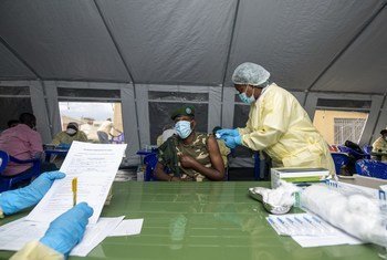 A nurse at North Kivu Provincial Hospital administers the first dose of the COVID-19 vaccine to a 45-year-old soldier in the Democratic Republic of the Congo.