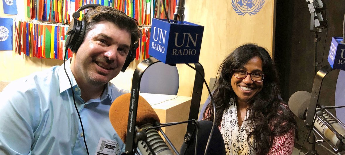 Jason DeWall (left) and Sinduja Srinivasan, hosts of the new UN News podcast, UNcomplicated.