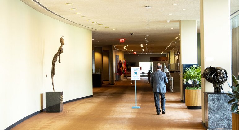 A delegate walks through the deserted corridors of the United Nations in New York.