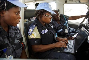 Peacekeepers write a report after patrolling an IDP camp in North Darfur, Sudan.
