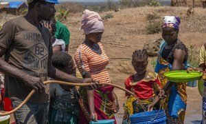 Displaced people queue for water at Metuge, Cabo Delgado Province, Mozambique.