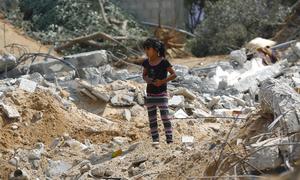 A girl stands near the rubble of a three-storey home which was destroyed during heavy bombardment by Israeli forces in the Gaza Strip. (file)