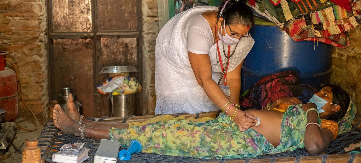 Midwifes are providing routine home visits to pregnant woman in India.