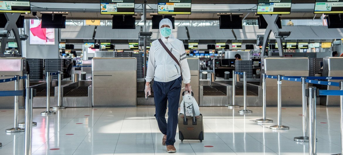 A solitary passenger at Suvarnabhumi Airport, Bangkok, Thailand.