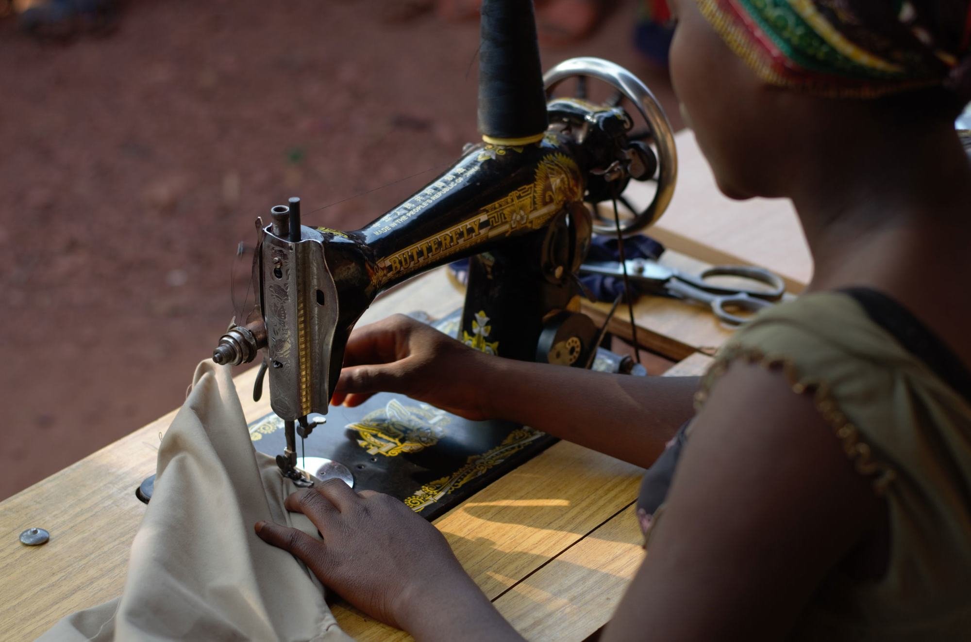 Now 16 and too old for primary school, Elisabeth is learning how to sew.