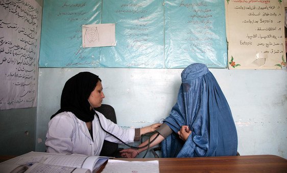 A midwife at a medical health clinic in Parwan Province, Afghanistan, checks the blood pressure of a 22-year-old woman. (file)