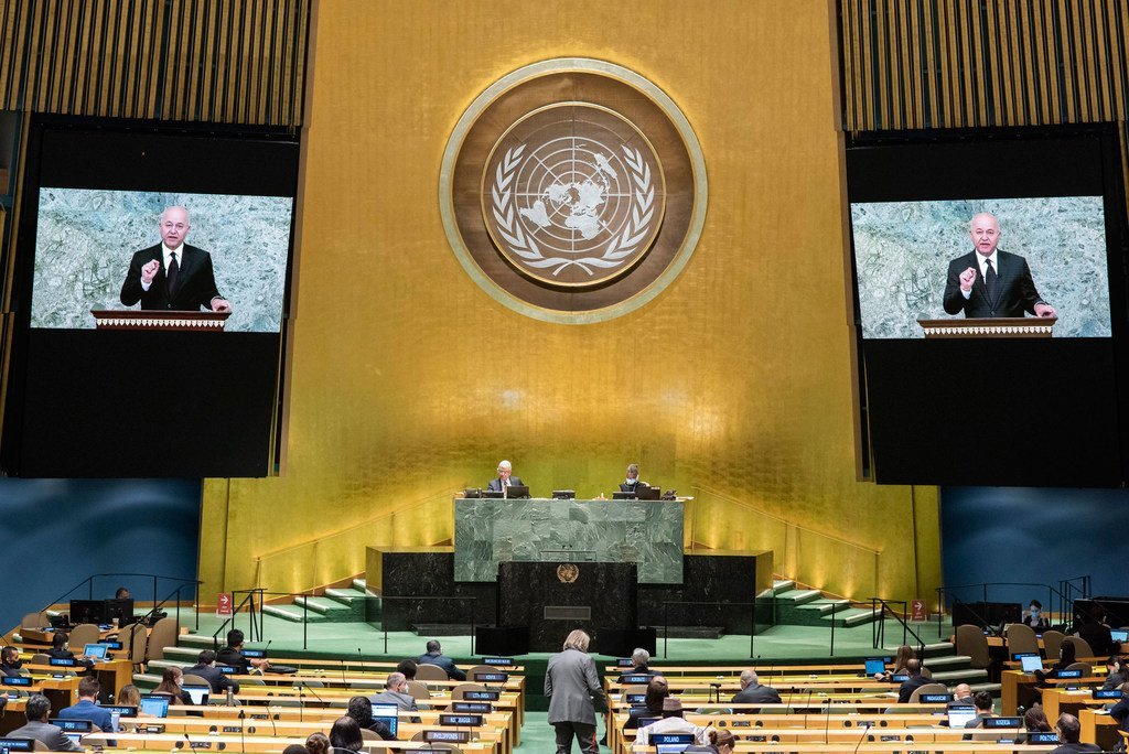 President Barham Salih (on screen) of Iraq addresses the general debate of the General Assembly’s seventy-fifth session.