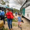 In Honduras, close to the Corinto border with Guatemala, police stop buses carrying migrants to check documentation and COVID test results.