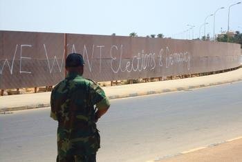 Graffiti on a wall in Benghazi, Libya, calls for elections and democracy.