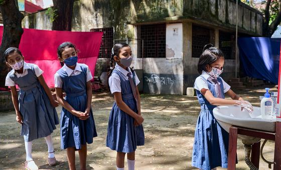 Students wash their hands at their school in Dhaka, Bangladesh.