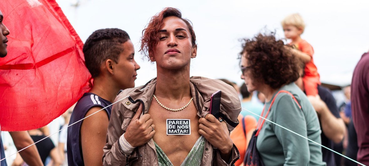 WellDonna Taiz Coelho advocates for her rights on the streets of Rio de Janeiro.  The sticker on her chest reads “stop killing us.”