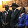 Salva Kiir, President of South Sudan, (centre right) shakes hands with Riek Machar, who was sworn in as  First Vice President of the new Transitional Government of National Unity on 22 February 2020. 