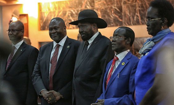 Salva Kiir, President of South Sudan, (centre right) shakes hands with Riek Machar, who was sworn in as  First Vice President of the new Transitional Government of National Unity on 22 February 2020. 