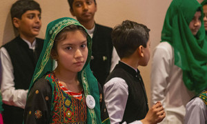 Children from a choir made up of refugee children from Afghanistan, and children from Pakistan, perform for the Secretary-General on his visit to Pakistan.
