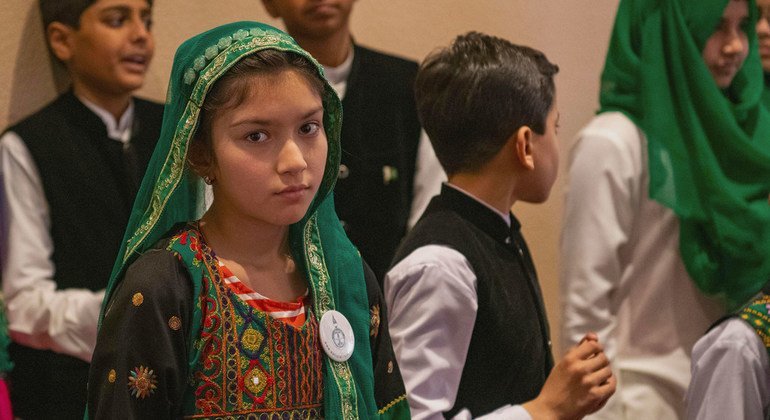 Children from a choir made up of refugee children from Afghanistan, and children from Pakistan, perform for the Secretary-General on his visit to Pakistan.