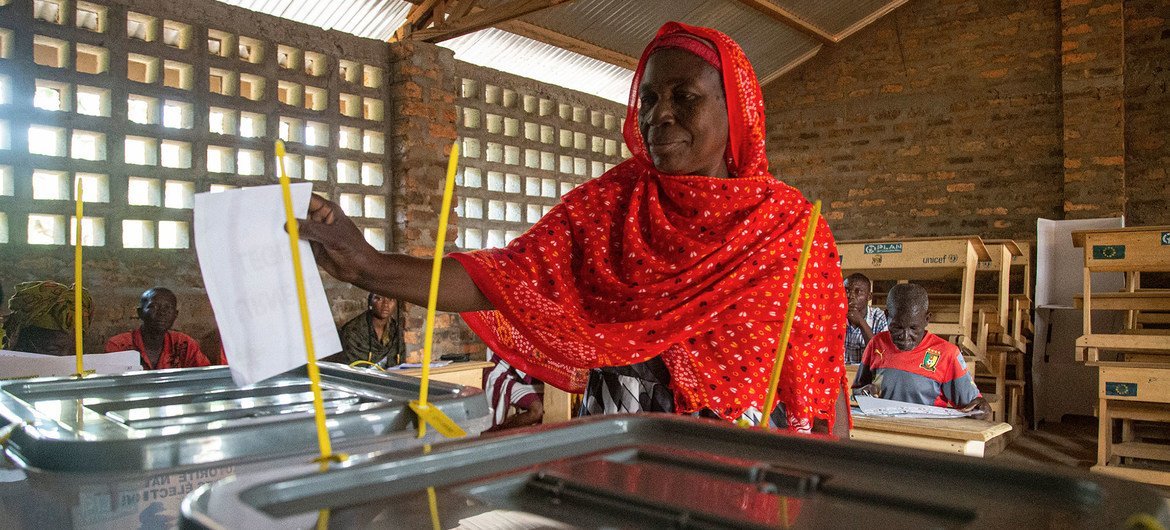 A woman casts her vote at a polling centre in the Central African Republic.
