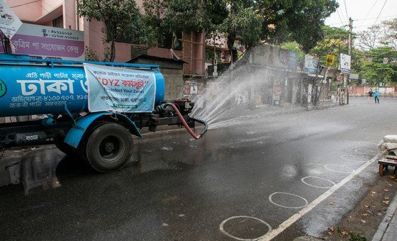 A municipal truck sanitizes the streets of Dhaka, Bangladesh in order to  prevent COVID-19.