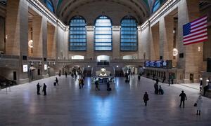A wide view of Grand Central Terminal with an unusually sparse crowd during the Coronavirus (COVID-19) outbreak in New York City.