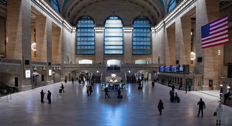 A wide view of Grand Central Terminal with an unusually sparse crowd during the Coronavirus (COVID-19) outbreak in New York City.