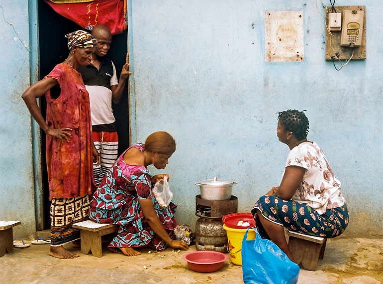 Elodie's family at the doorstep of their home in Abidjan, Côte d'Ivoire.