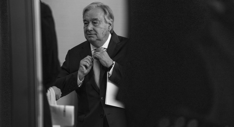 UN Secretary-General António Guterres adjusts his tie ahead of the closing the UN Climate Action Summit 2019.