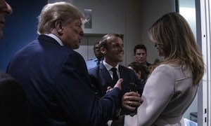 Emmanuel Macron (center), President of France, greets Donald J. Trump, President of the United States, and First Lady Melania Trump prior to the opening of the 74th session of the General Assembly. (24 September 2019)