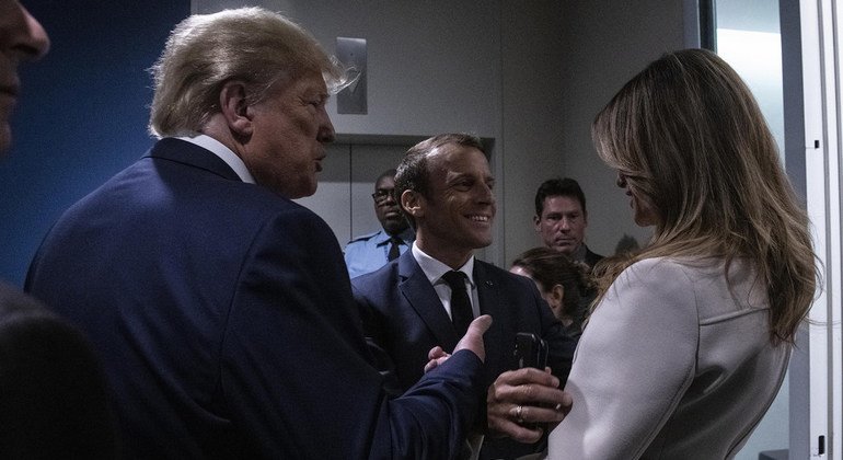 Emmanuel Macron (center), President of France, greets Donald J. Trump, President of the United States, and First Lady Melania Trump prior to the opening of the 74th session of the General Assembly. (24 September 2019)