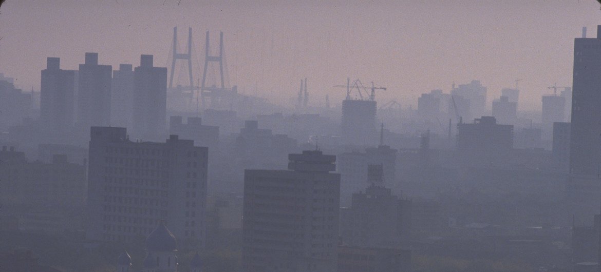 Pollution fills the skyline of the Chinese city of Shanghai at dusk.