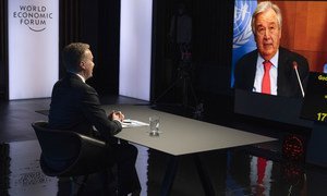 UN Secretary-General António Guterres (on screen) addresses the World Economic Forum Annual Meeting in Davos-Klosters, Switzerland.