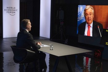 UN Secretary-General António Guterres (on screen) addresses the World Economic Forum Annual Meeting in Davos-Klosters, Switzerland.