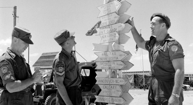 To remind them of home, members of the Royal Canadian Electrical and Mechanical Engineers built a signpost outside their workshop, giving the various distances to leading Canadian cities.