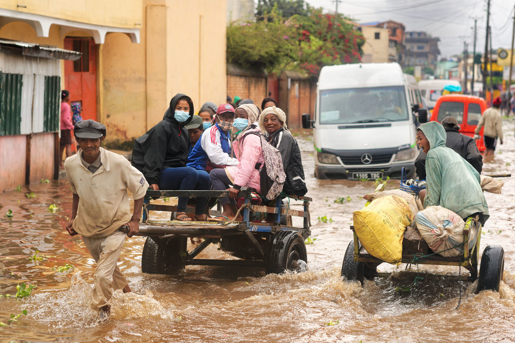 A man transports people on a cart on the flooded main road in Ilanivato district, Antananarivo. Madagascar.