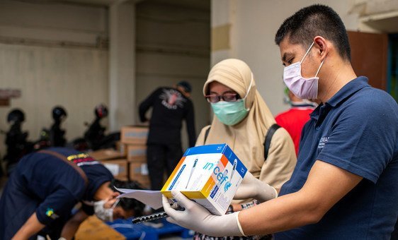 Medical equipment supplied by UNICEF is checked at a warehouse in Indonesia. 