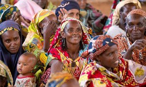 Women attend a community meeting in Cameroon.