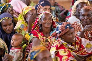 Women attend a community meeting in Cameroon.