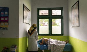 In Ambon, Indonesia, a pregnant woman has a check-up at a local health centre.