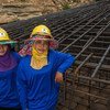 Female construction workers help to build the foundation for a wind farm in Thailand.