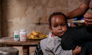 One-year-old Lighton receives her pediatric HIV medicine at the same time at home every day in Mbarara, Uganda.