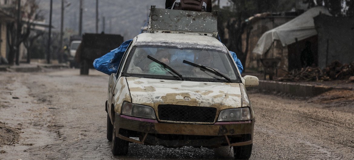 A family arrives in Afrin in northern Aleppo governorate in Syria after escaping conflict in rural Idlib. (file photo)