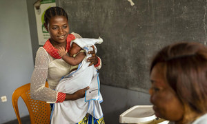 Twenty-six year old Mama Bwanga takes her baby to at a health centre in the Democratic Republic of the Congo (DRC).  