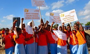 In Dar es Salaam, Tanzania, school girls organize a march against gender violence.