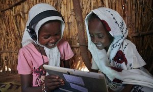 Children use their tablet at a UNICEF supported learning centre in a village on the outskirts of Kassala, in Eastern Sudan.